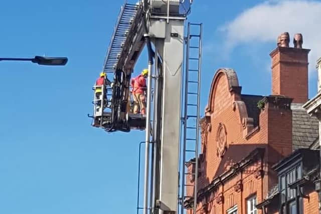 Firefighters are using aerial equipment to tackle the blaze. Photo by Nina Hodgson