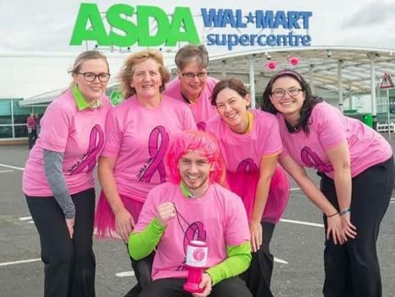 Asda colleagues in Wigan get "tickled pink" for Breast Cancer Awareness Month