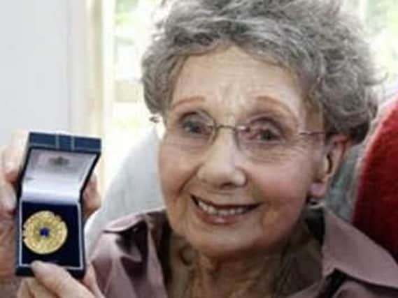 Edna Mountford with her medal