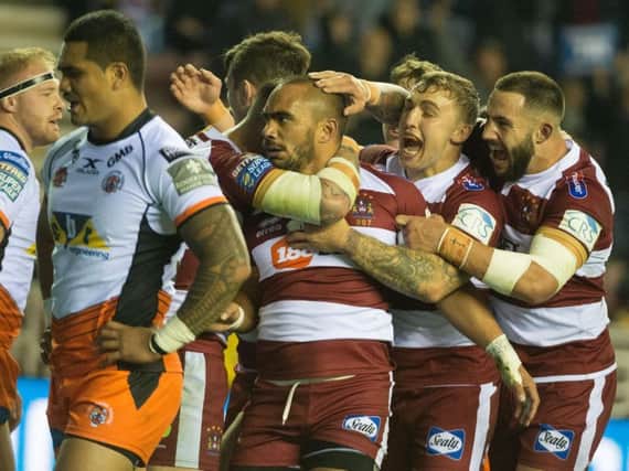 Warriors celebrate after Thomas Leuluai's try gave them a first-half lead