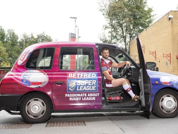 Sean O'Loughlin in one of the Betfred taxis