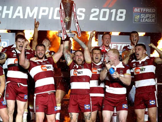 Wigan Warriors lift the Super League trophy at Old Trafford