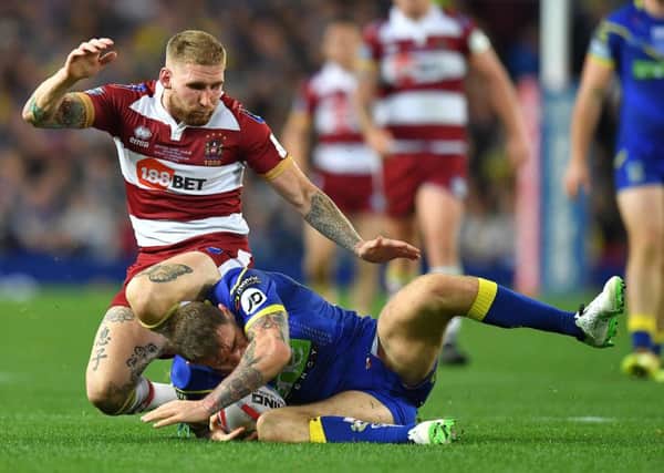 Wigan Warriors' Sam Tomkins was penalised for this challenge on Warrington Wolves's Daryl Clark