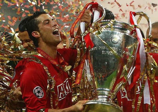 Cristiano Ronaldo (left)  with the Champions League trophy in Moscow in 2008