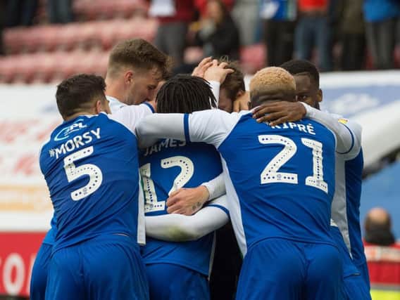 Josh Windass is mobbed by his team-mates after scoring the winner during Latics 1-0 win over West Brom last Saturday