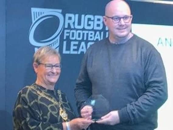 Craig Fisher receives his award at Old Trafford