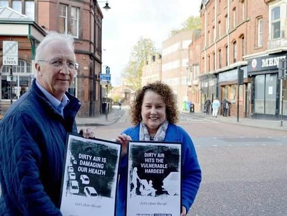 Wigan Councils leader Coun David Molyneux and public health director Prof Kate Ardern highlighting the importance of clean air in the town centre