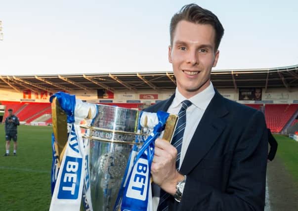 David Sharpe with the League One title