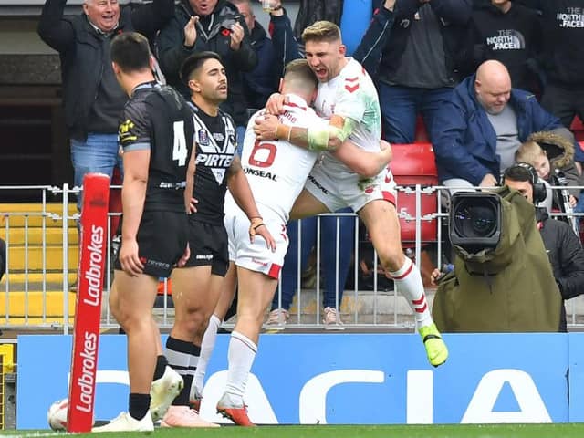 Tommy Makinson celebrates with George Williams