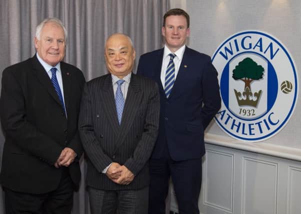 IEC CEO Melvin Yan Min Zhang (centre), flanked by Joe Royle (left) and Darren Royle (right)