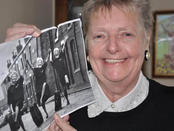 Enid Keats with the photograph of her, Liz Ramsdale and Sylvia Armstrong dancing on the Bird Street cobbles