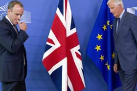 Former Secretary of State for Exiting the European Union Dominic Raab, left, and EU chief Brexit negotiator Michel Barnier