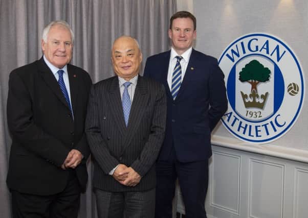 Joe Royle (left) with son, Darren (right), and IEC chief executive Melvin Yan Min Zhang