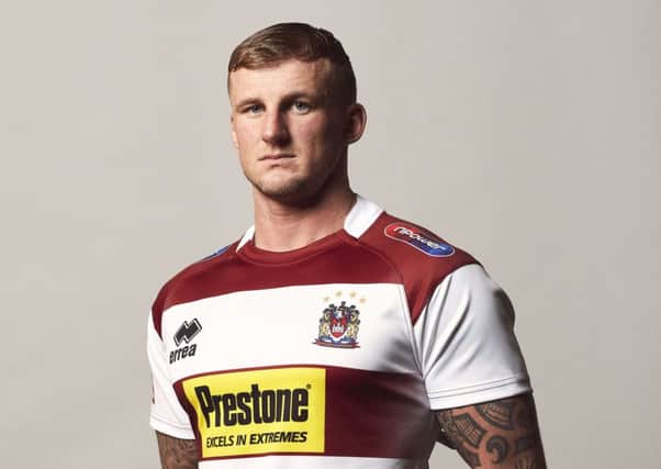 Dom Manfredi in the new Wigan home shirt