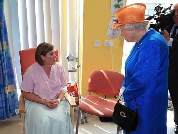 Ruth Murrell, who was injured with her daughter Emily, 12, in the Arena terror attack, meeting the Queen