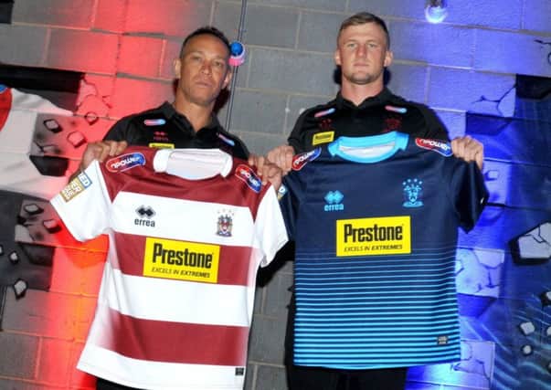 Adrian Lam, pictured with Dom Manfredi showing off the new shirts, may be taking his side to Barcelona