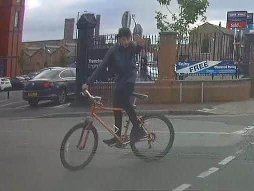 The cyclist gesticulating at the dashcam driver