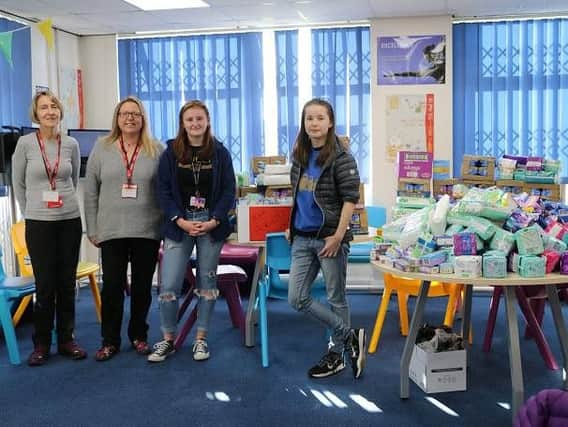 The Brick collecting sanitary items donated to tackle period poverty from Winstanley College students