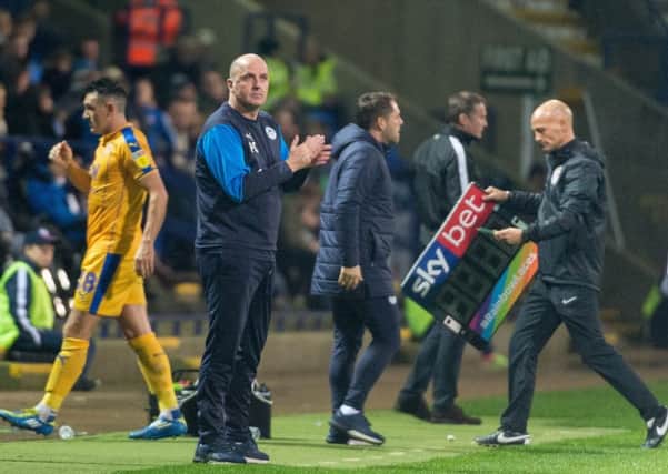 Paul Cook on the touchline at Horwich