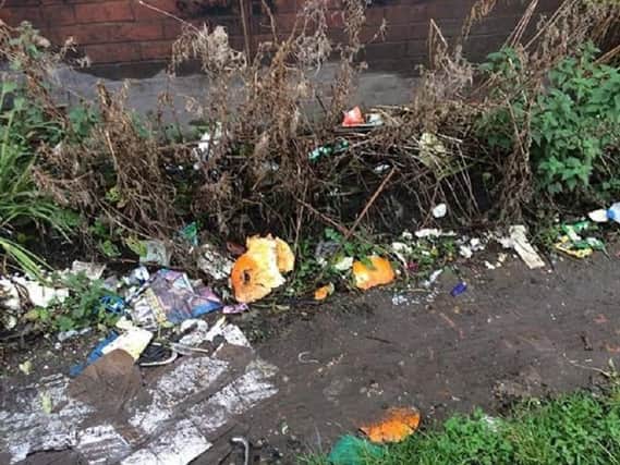 Rubbish dumped behind London House on Wigan Lane