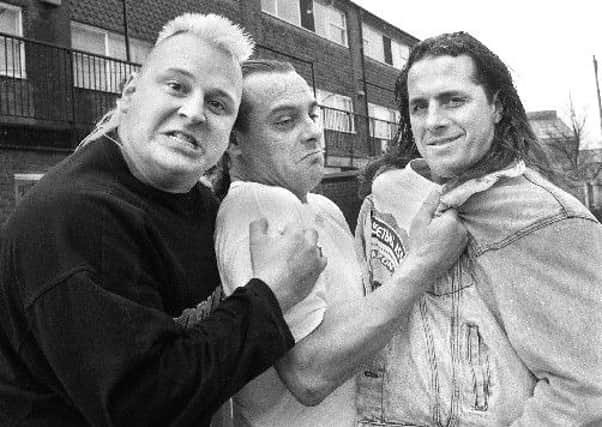 Tom Billington (centre) pictured outside his house in Platt Bridge in 1993 with Nasty Boy Brian Nobbs (left) and Bret 'Hitman' Hart (right)
