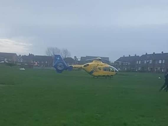 The air ambulance landed on a field by Hodder Close, off Montrose Avenue