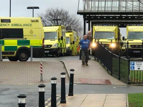 Ambulances queuing outside Wigan Infimary last winter as A&E was pushed to breaking point