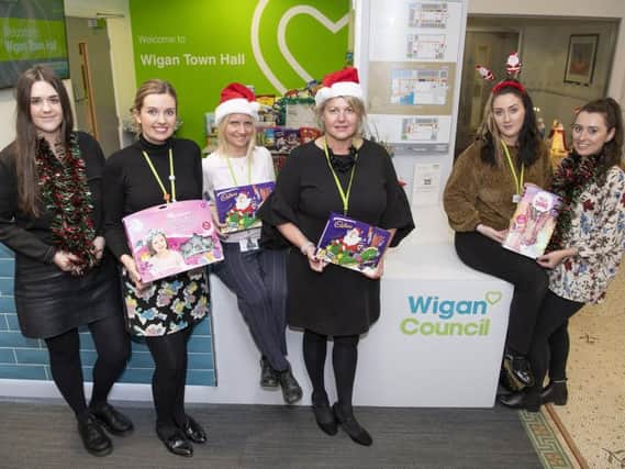 Wigan Council staff with some of the toys contributed to the appeal so far