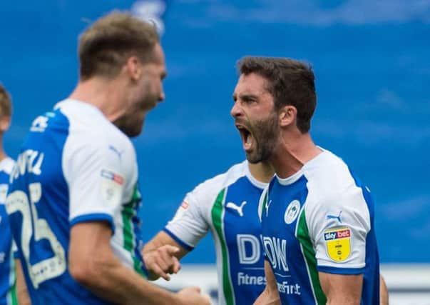 Will Grigg, with Nick Powell