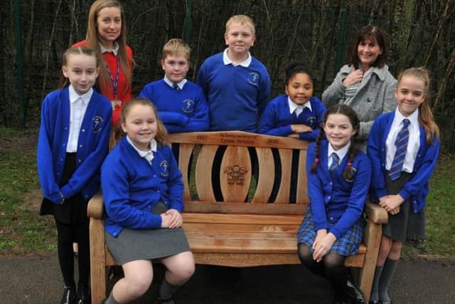 Pupils from Year Six with teachers Hannah Davies, left, and Diane Rimmer, right, who is also sister of the late Lynne Newton