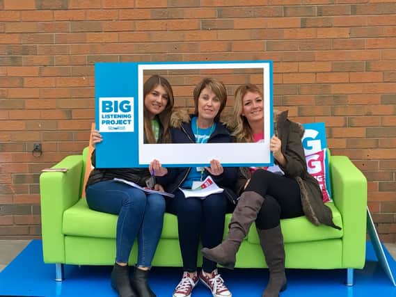 Members of the Big Listening Project team on the listening sofa
