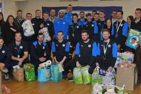 Latics first team players gave a helping hand with packing Christmas hampers for The Brick