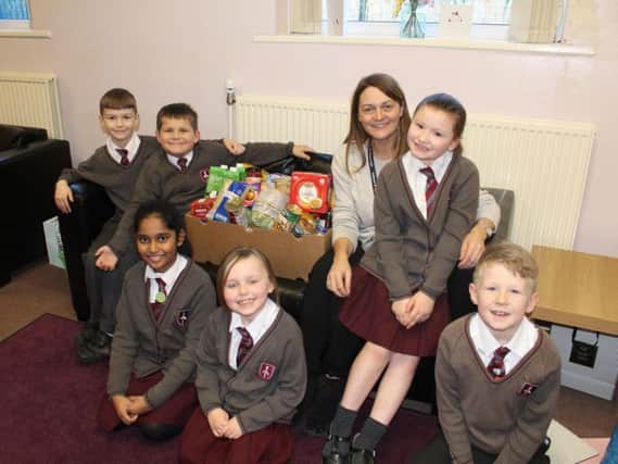 Mrs Bilski, who started the appeal, with St Thomas CofE pupils