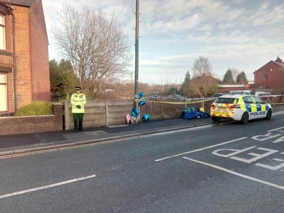 Police remained on Bickershaw Lane on Saturday afternoon