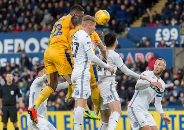 Joe Garner nods home at the Liberty Stadium