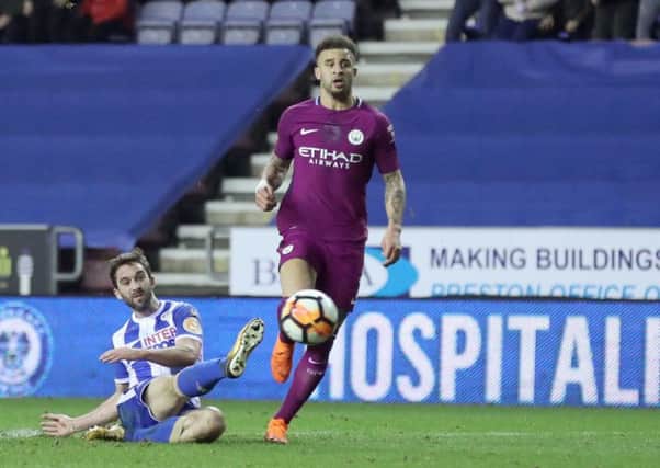 Will Grigg scores against Manchester City in last season's FA Cup