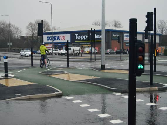 A cyclist uses the revamped Saddle junction