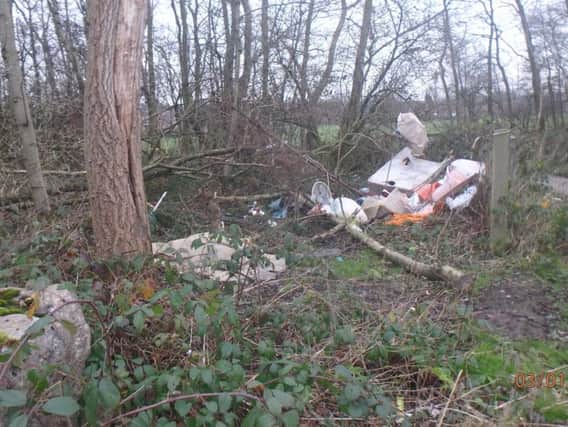 Fly-tipped rubbish on the lane off Ince Hall Avenue