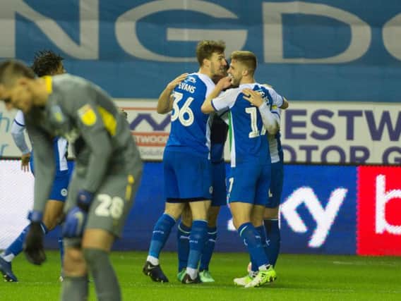 Wigan Athletic players celebrate on Saturday