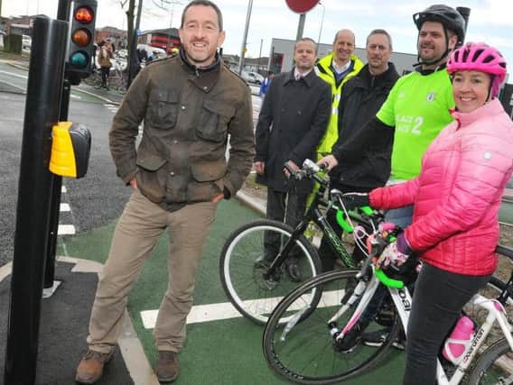 Former Olympic cyclist Chris Boardman, left, officially opens the new cycle lanes at the repurposed Saddle Junction, Wigan, pictured with, from second left, Coun Carl Sweeney, Ian Tyler contracts manager at AE Yates, Steve Benyon Wigan Council major projects manager, local residents and cyclist Peter Hill and Joy Lummis volunteer rider for Breeze, British Cycling encouraging women to cycle