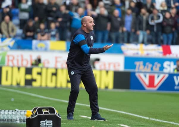 Paul Cook on the touchline during Wigan Athletic's 2-1 home defeat to Leeds earlier this season
