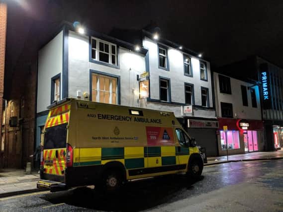 An ambulance outside the White Horse in Standishgate