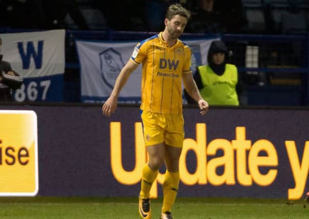 Will Grigg finished the game at Sheffield Wednesday in discomfort after injuring his ankle