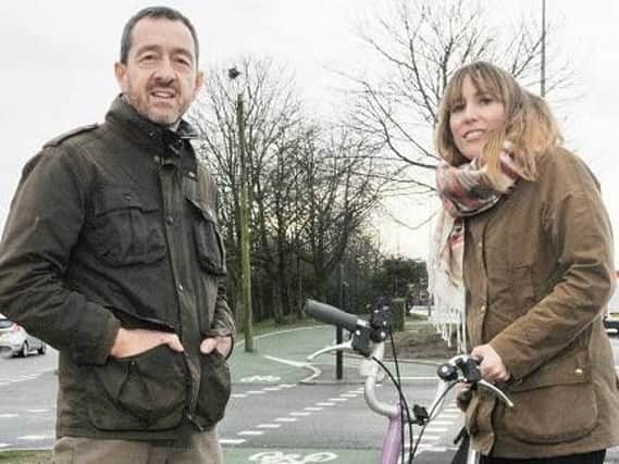 Chris Boardman and cyclist at the official opening of the new Saddle Junction cycle lanes