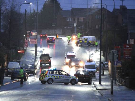 Police cordon off the road in Ashton in 2015