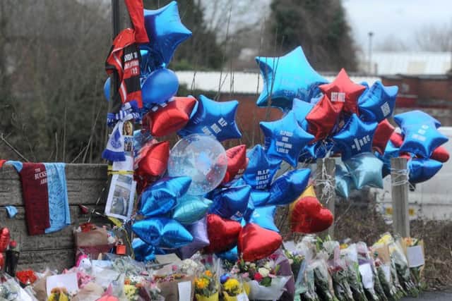 Balloons, flowers and other tributes were left on Bickershaw Lane, Abram in memory of Billy