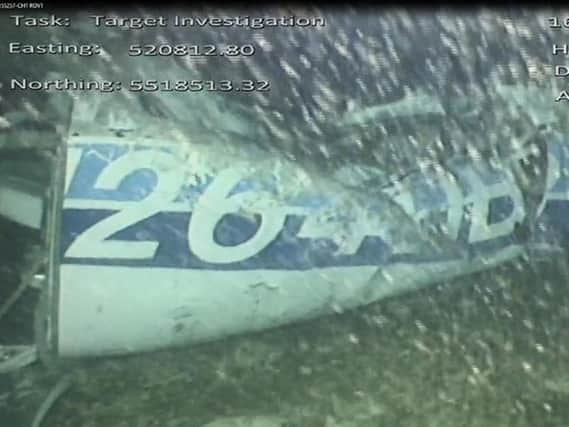 Still from handout video issued by the Air Accidents Investigation Branch showing the rear left side of the fuselage, including part of the aircraft registration, in the wreckage of the plane which was carrying Cardiff City footballer Emiliano Sala