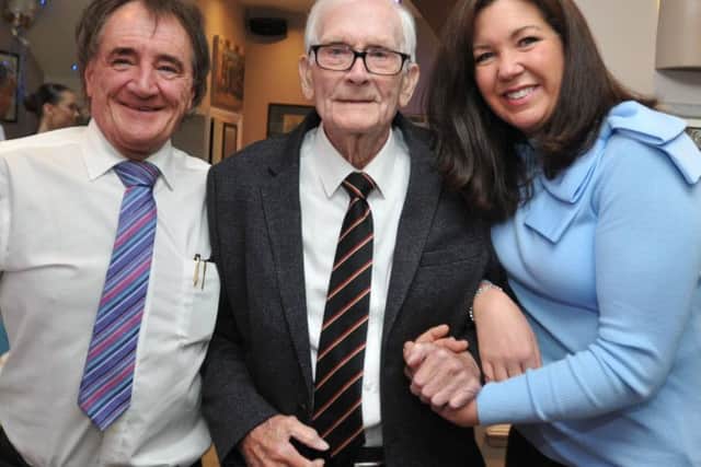 James Gallimore (known as Jimmy), celebrates his 100th birthday, surrounded by family and friends at his son's restaurant, Howard Gallimore, left, of Gallimore's Restaurant, Wigan, pictured with great niece Nikki Fletcher, right.