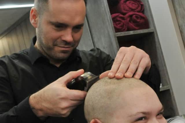 Barber Byron Milne shaves off Zeta-Marie's hair