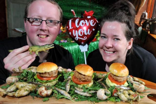 Head chef Mike Robinson and pub manager Andrea OToole with an unusual Valentines Day menu, exotic items such as frogs legs and crocodile sliders